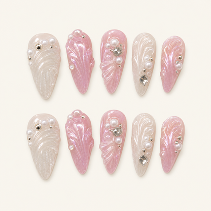 Pearl shell press-on nails on ivory background