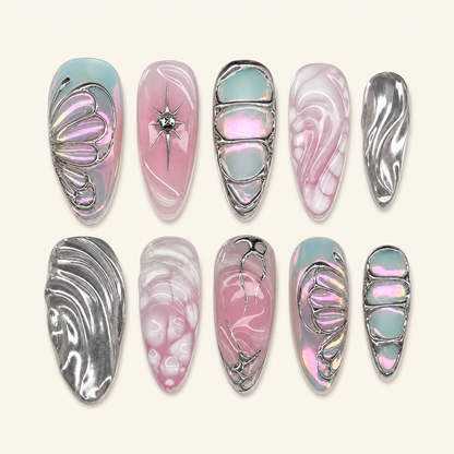 Silver butterfly press-on nails on ivory background