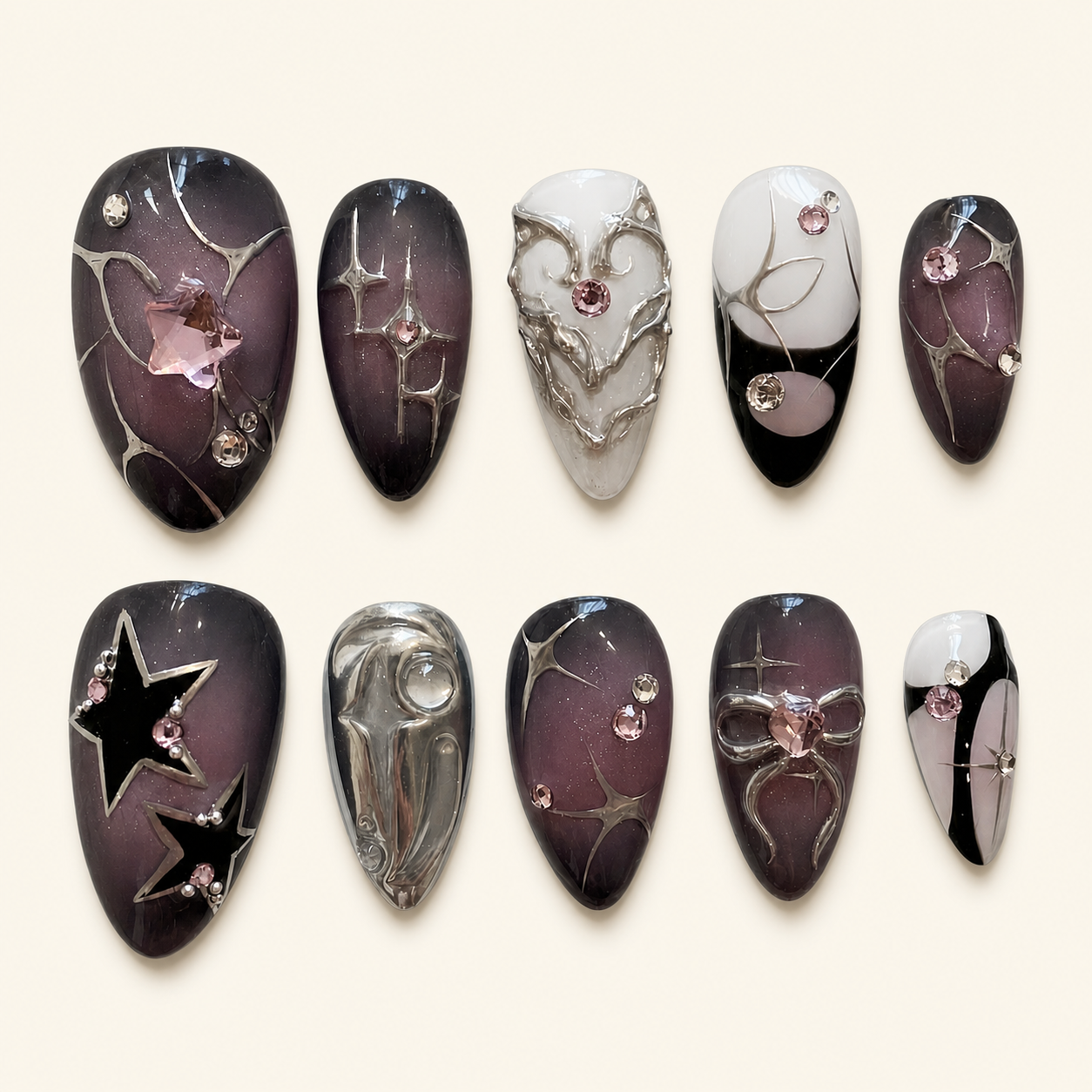 Smoky rhinestone press-on nails on ivory background