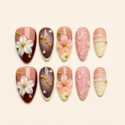 Pink burgundy camellia press-on nails set on warm ivory background